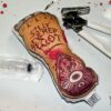 Severed foot, can opener and syringe