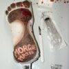 Severed foot, scalpel and syringe