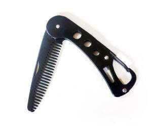 Fold out metal comb