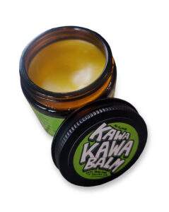 Open jar of kawakawa balm