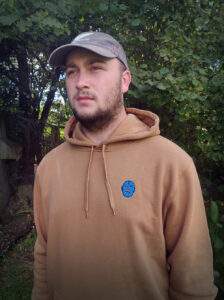 A male wearing a hoodie